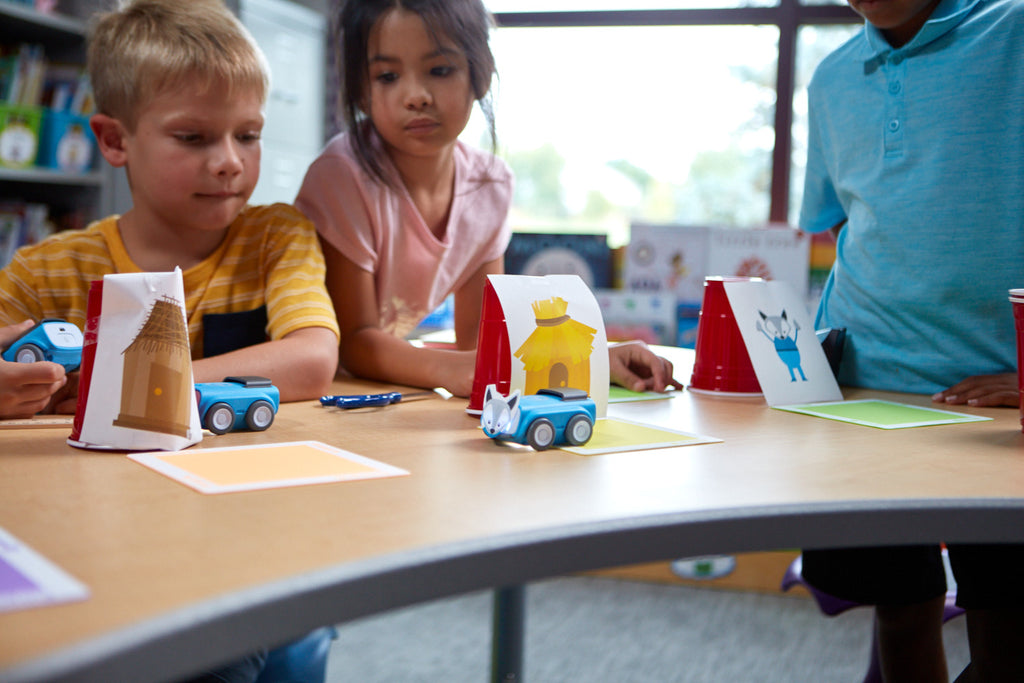 Students code their Sphero indi to tell the story of the three little pigs.