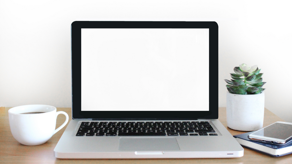 A laptop computer sitting on a desk.